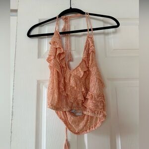 Free people tank top- ties around the neck and the back is open